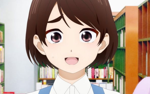 a close up of a girl 's face in a library .