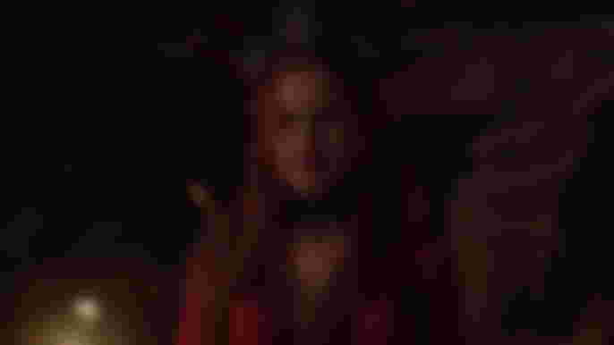 Riverdale Season 6 Madelaine Petsch as Cheryl Blossom wearing red dress and crown