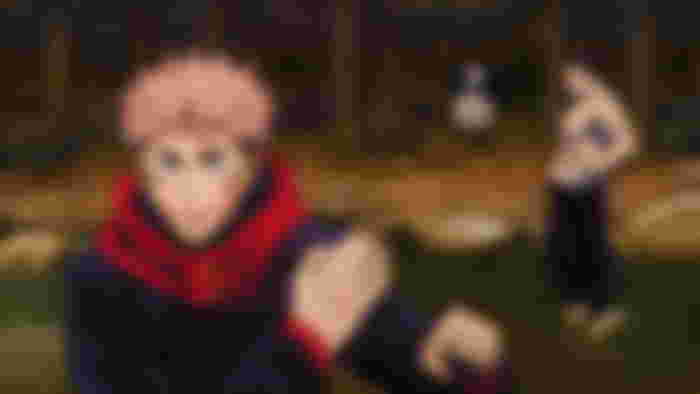 Itadori preparing to fight with Todo in the background.