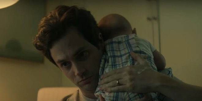 Joe holding his baby Henry