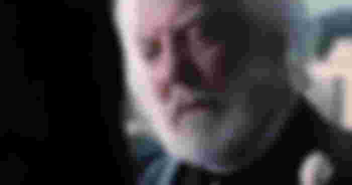 why does president snow wear roses: Donald Sutherland as President Coriolanus Snow