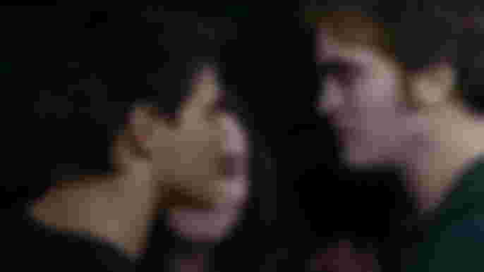 Robert Pattinson as Edward Cullen, Taylor Lautner as Jacob Black in Twilight
