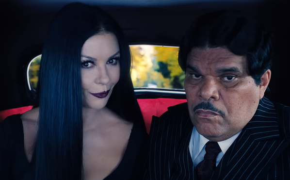 Catherine Zeta-Jones as Morticia Adams, Luis Guzmán as Gomez Addams in Wednesday