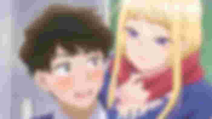 a boy and a girl are standing next to each other in a room .