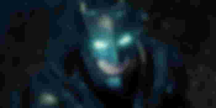 Ben Affleck's Batman looking up with glowing eyes