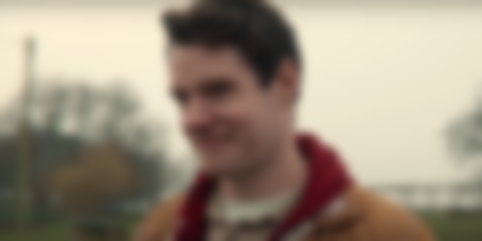 Adam smiling in Sex Education Season 4