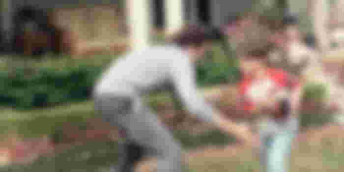 Graham playing with his son