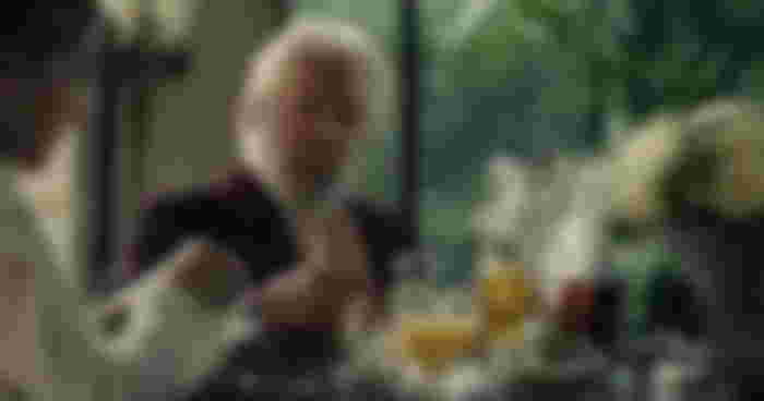 why does president snow wear roses: Donald Sutherland as President Coriolanus Snow