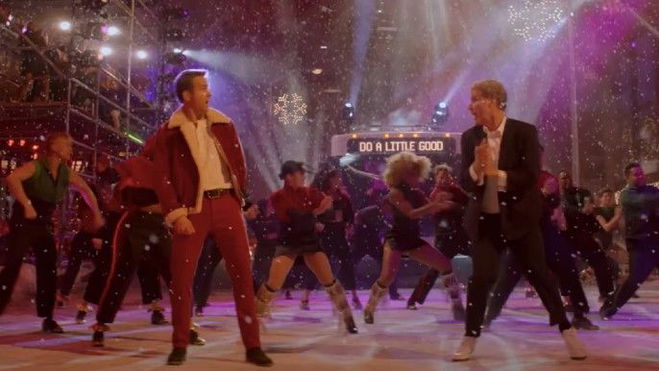 Will Ferrell as the Ghost of Christmas Present, Ryan Reynolds as Clint Briggs in Spirited