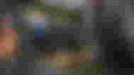 Modern Warfare 3 Captain Price taking cover next to wall with opponents in background