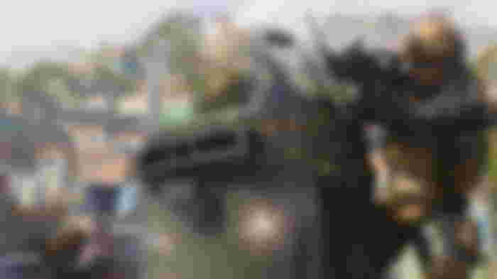 Modern Warfare 3 player firing gun with player holding riot shield in foreground