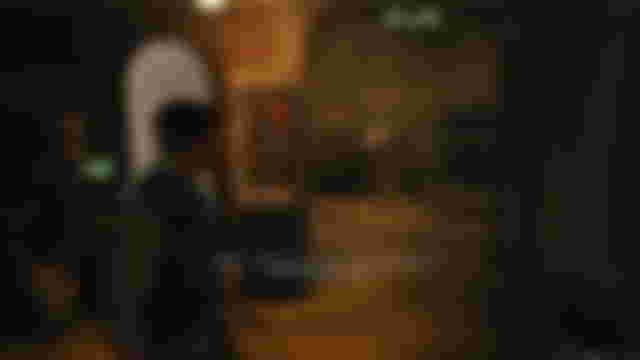 Screenshot of Star Wars Jedi Survivor inside Doma's shop near an unlocked door with a keypad on the left hand side.