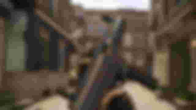 Screenshot of Modern Warfare 2 player holding ISO 45 SMG in an abandoned urban street.