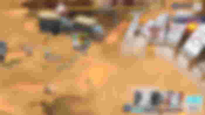 Screenshot from Blue Archive, showing three characters in battle on a desert landscape