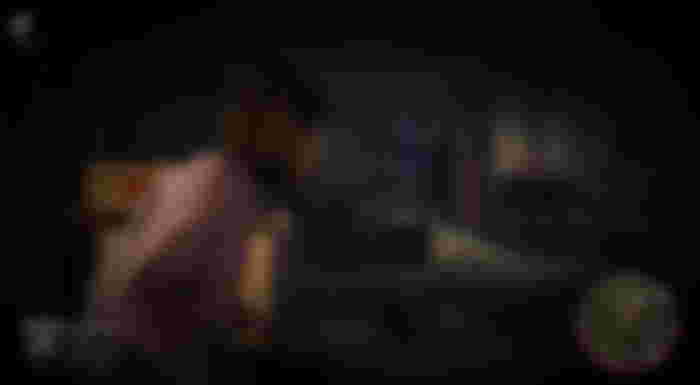 A player fleeing killer, Jason Voorhees, in Friday the 13th: The Game.