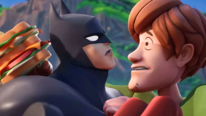 Batman cradling Shaggy from Scooby Doo whilst holding a sandwich 