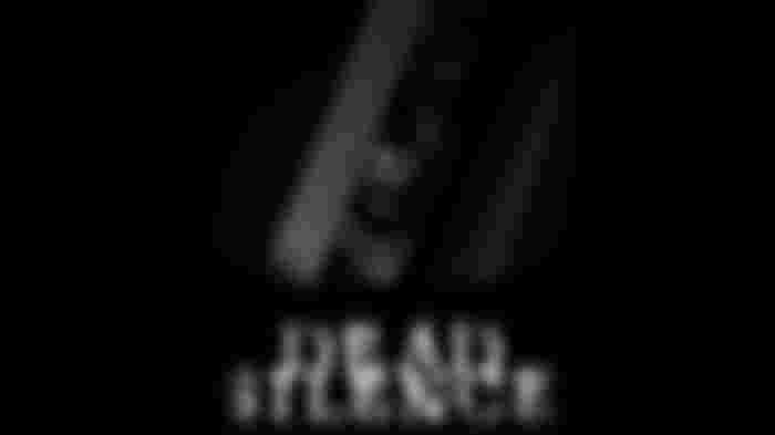 Screenshot from Dead Silence, showing a demonic face locked behind bars