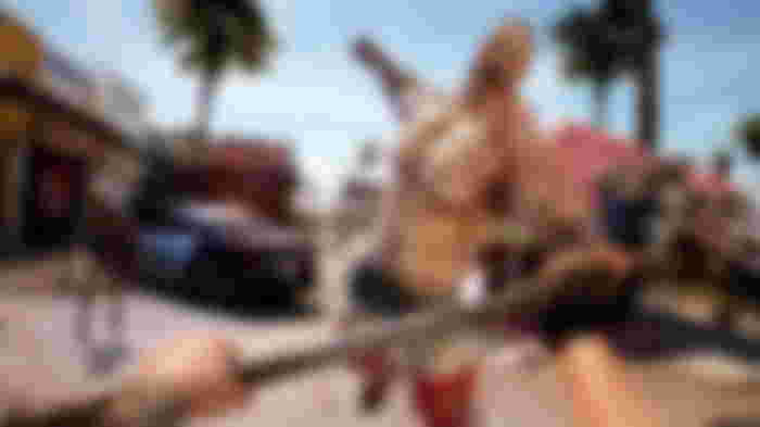 Dead Island 2 zombie fighting the player character