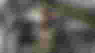 Call of Duty Warzone character holding shotgun with one arm over shoulder