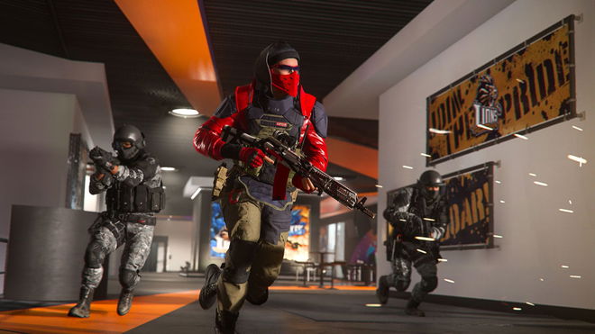 Screenshot of Warzone players running through a corridor carrying guns