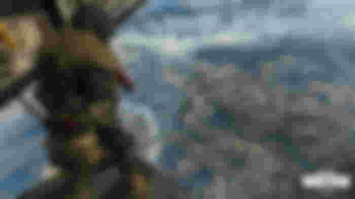 An Operator looks down over Verdansk from the back of a plane in Call of Duty Warzone.
