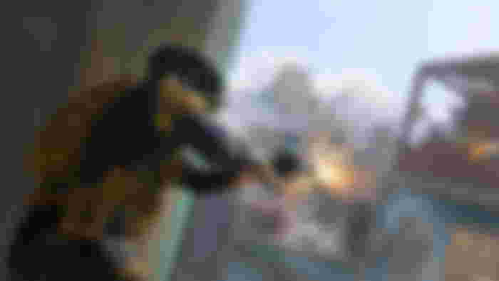 Modern Warfare 3 player firing weapon at opponent