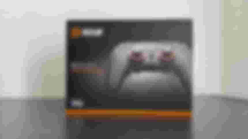 The SCUF Reflex Pro box, featuring an image of the controller and a black and orange color scheme.