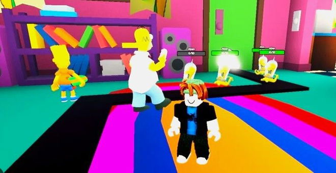 The Simpsons Tower Defense gameplay featuring the aliens, Homer, and Bart