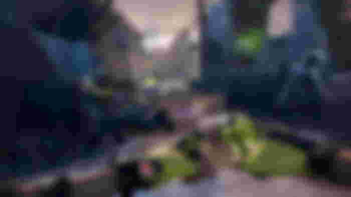 An Operator using a smoke grenade against Grunts and a Bloater in Rainbow Six Extraction.