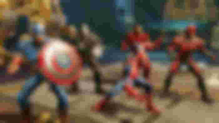 A team of Marvel Strike Force characters including Captain America, Iron Man, and Spider-Man.