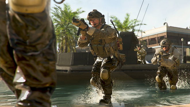 Image showing Modern Warfare 2 players walking through water near boat
