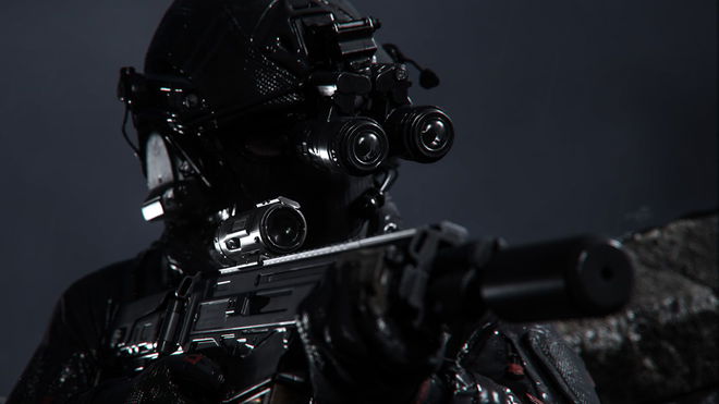 Modern Warfare 3 player aiming suppressed rifle while wearing night-vision goggles