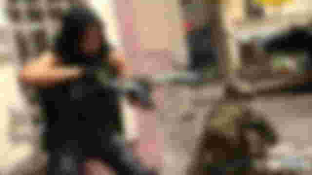 Modern Warfare 2 player holding assault rifle next to crouched player