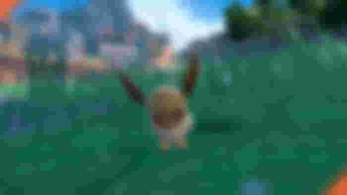 A dancing Eevee in the wild in Pokemon Scarlet and Violet.