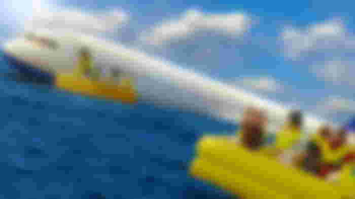 Roblox - characters escaping a plane on water using yellow inflatable dinghys
