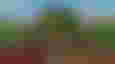 The player aiming down sights in Unturned.
