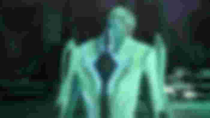 Dr. Sigurd with his back to the camera in Bayonetta 3.