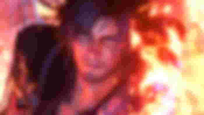 Clive from Final Fantasy 16 using his magic hand to summon fire