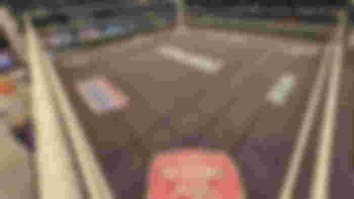 A ring mat picture from WWE featuring multiple sponsors including Fortnite