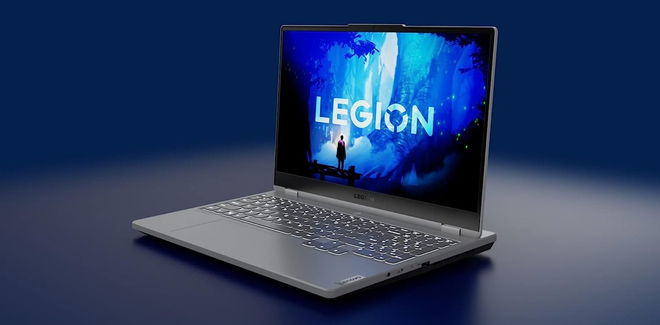 Image of a light grey laptop in front of a blue background with blue Legion branding on the display.
