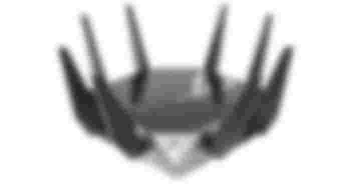 ASUS ROG Rapture GT-AXE11000 product image of a black WiFi router with eight antennae sticking upwards.