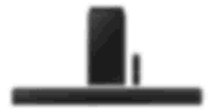 Samsung HW-C450 product image of a long, black, rectangular soundbar in front of a black speaker and remote.