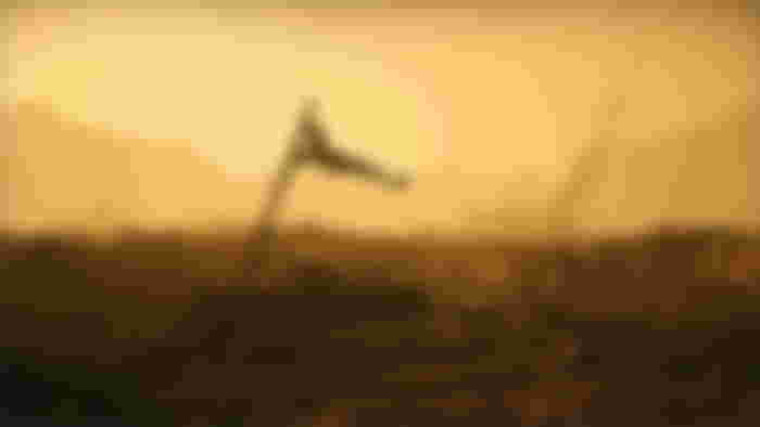 Tattered flag flying in the desert