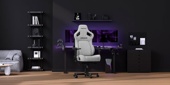 a gaming chair is sitting in a living room next to a computer desk .