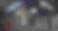 A collection of doomsday preppers items in front of a cloudy grey background.