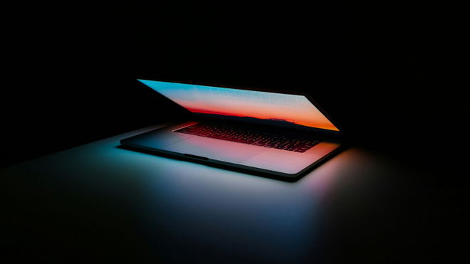Laptop with a black background.