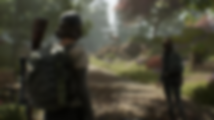 Two characters in The Day Before exploring a lush green scenery