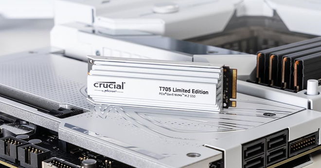 A white SSD with white branding on its layered front sat on top of internal PC components.