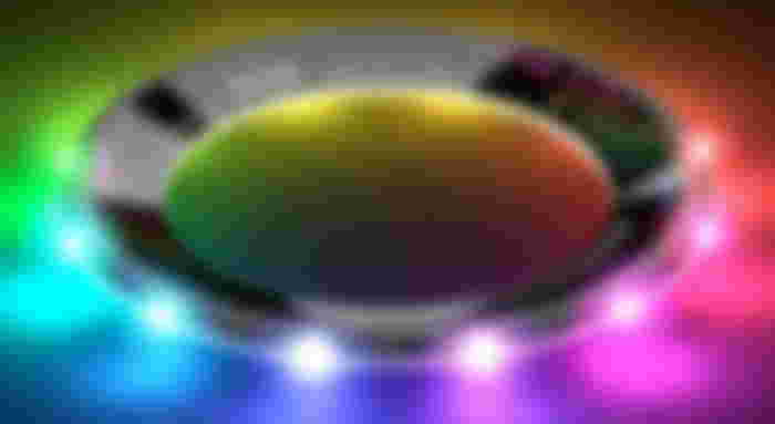 A black frisbee with multicolored lighting around the outside.