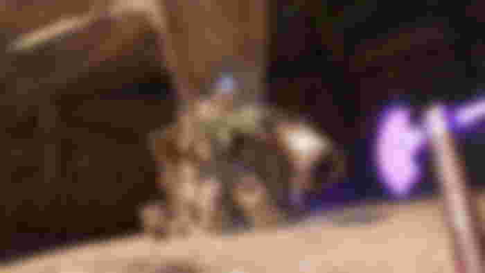 POV of a character in blade and sorcery holding a purple axe imbued with gravity as Hector the Golem stands up to fight
